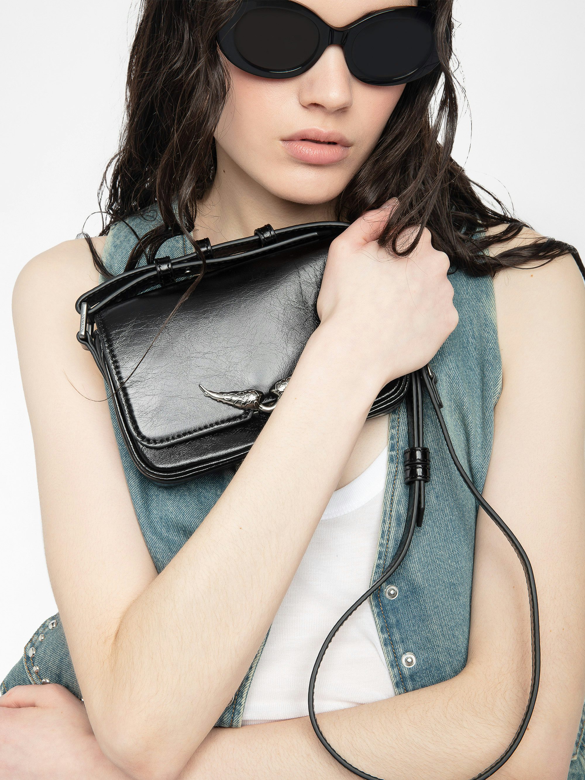 Le Zazi Vintage Patent Bag - Small vintage-inspired patent leather bag with adjustable shoulder strap and signature wings.